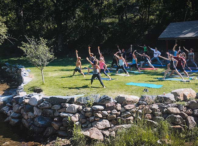 Outdoor group yoga at A-Lodge in Boulder, Colorado